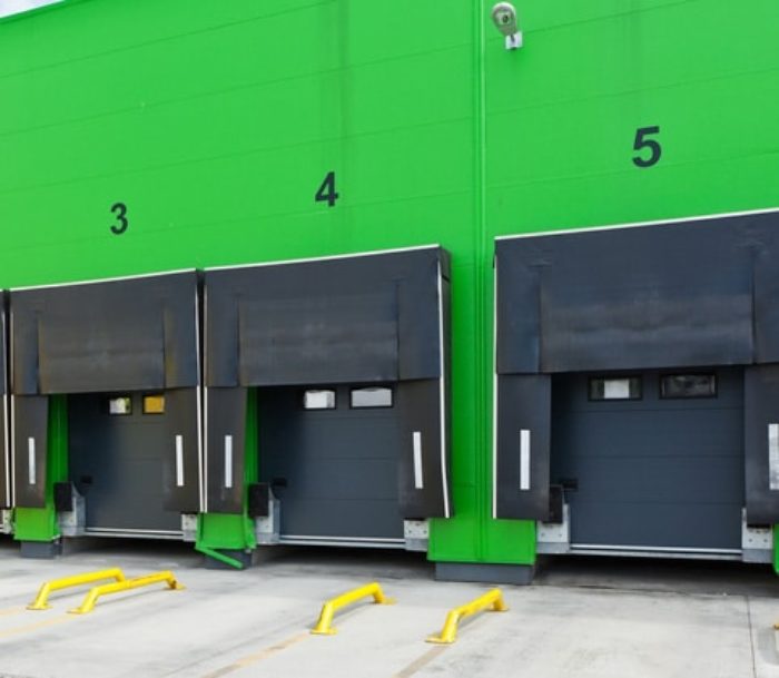 Row of Commercial Overhead Doors with Many Accessories